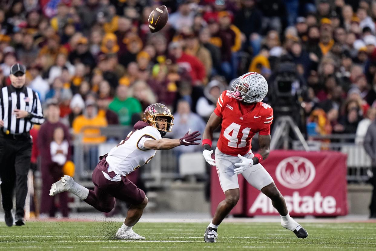 Nov 18, 2023; Columbus, Ohio, USA; Ohio State Buckeyes safety Josh Proctor (41) breaks up a pass intended for Minnesota Golden Gophers wide receiver Daniel Jackson (9) during the NCAA football game against the Minnesota Golden Gophers at Ohio Stadium.