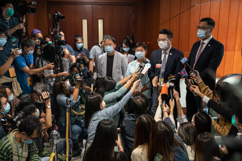 HONG KONG, CHINA - NOVEMBER 12: Pro-democracy lawmakers Helena Wong, Wu Chi-wai, Andrew Wan Siu-kin and Lam Cheuk-ting speaks to members of media after tendering their letters of resignation at the Legislative Council on November 12, 2020 in Hong Kong, China. Hong Kong's government removed four pro-democracy lawmakers from the city's legislative council after China passed a ruling that allowed for the disqualification of lawmakers deemed to be unpatriotic, a move that could result in a mass resignation by the pro-democracy camp. (Photo by Anthony Kwan/Getty Images)