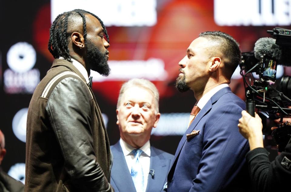 Wilder and Joseph Parker, a former opponent of Joshua, face off at Wembley Arena (PA)