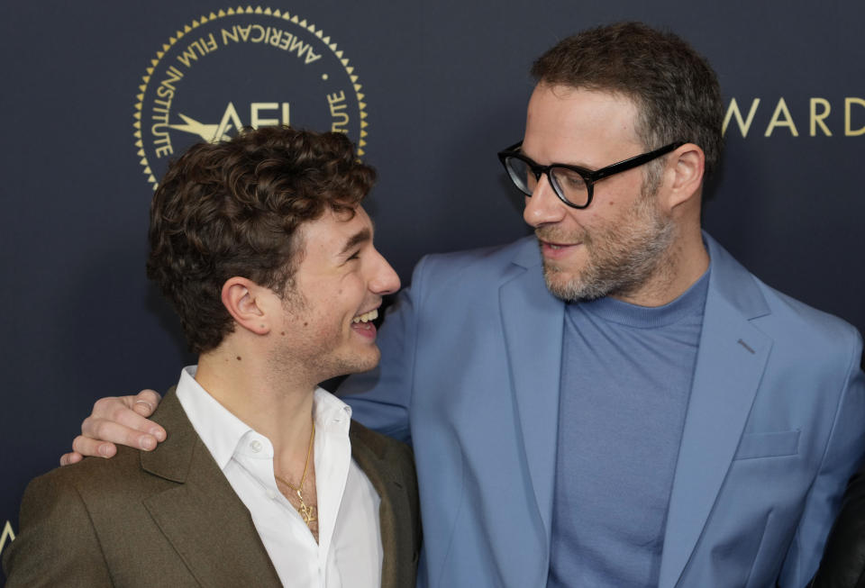 Gabriel LaBelle, left, and Seth Rogen, cast members in the film "The Fabelmans," mingle at the 2023 AFI Awards, Friday, Jan. 13, 2023, at the Four Seasons Beverly Hills in Los Angeles. (AP Photo/Chris Pizzello)