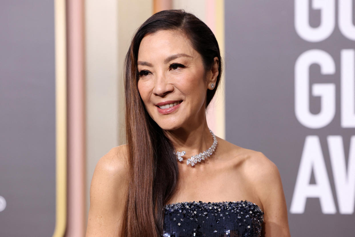 Michelle Yeoh rocked a midnight blue Armani Privé gown for the 80th Golden Globes on Tuesday. (Photo via Reuters/Mario Anzuoni)