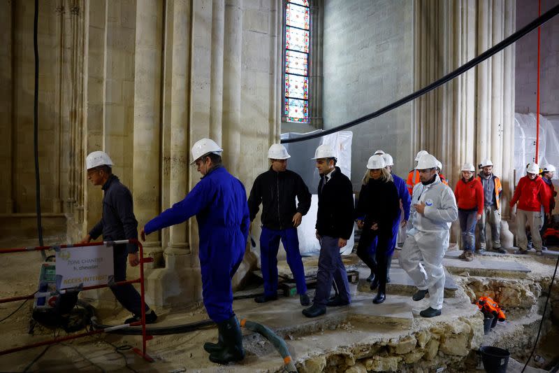 French President Macron visits Paris' Notre-Dame cathedral a year before its reopening