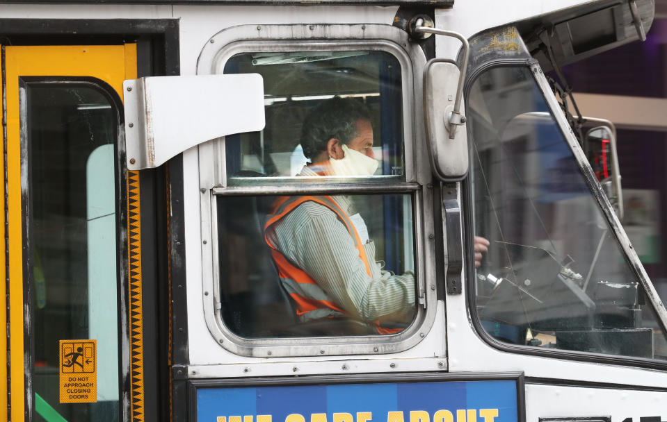 A tram driver is seen wearing a mask in Swanston street in Melbourne, Sunday, July 19, 2020.