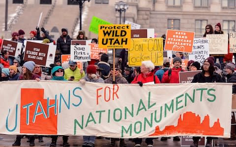 Protesters gather before a visit by President Donald Trump to announce that he is scaling back two sprawling national monuments - Credit: The Salt Lake Tribune 