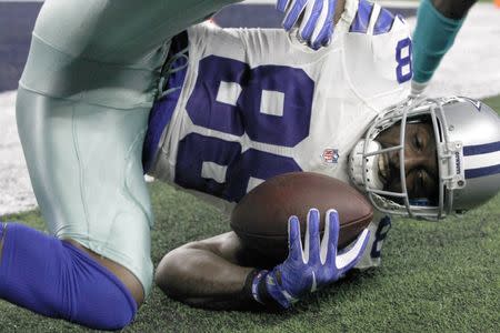 FILE PHOTO: Aug 19, 2016; Arlington, TX, USA; Dallas Cowboys wide receiver Dez Bryant (88) scores a touchdown in the first quarter against the Miami Dolphins at AT&T Stadium. Mandatory Credit: Tim Heitman-USA TODAY Sports / Reuters Picture Supplied by Action Images/File Photo