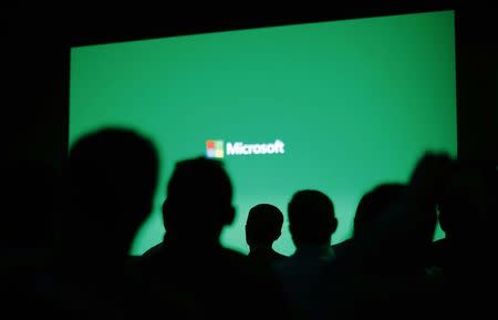 People attend a presentation of the Xbox One by Microsoft as part of ChinaJoy 2014 China Digital Entertainment Expo and Conference in Shanghai July 30, 2014. REUTERS/Carlos Barria