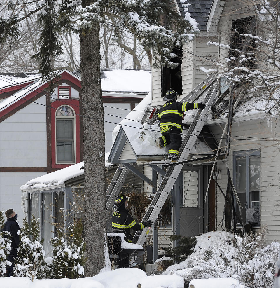 Firefighters work at the scene of a house fire on the 700 block of W. Oakton that claimed the lives of 5 people, Wednesday, Jan. 27, 2021 in Des Plaines, Ill. (Mark Welsh/Daily Herald via AP)