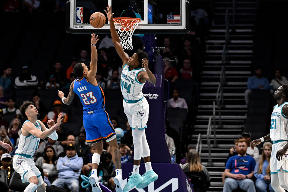 CHARLOTTE, NORTH CAROLINA – OCTOBER 15: Frank Ntilikina #44 of the Charlotte Hornets blocks a shot from Tre Mann #23 of the Oklahoma City Thunder during the first quarter of the game at Spectrum Center on October 15, 2023 in Charlotte, North Carolina. (Photo by Matt Kelley/Getty Images)