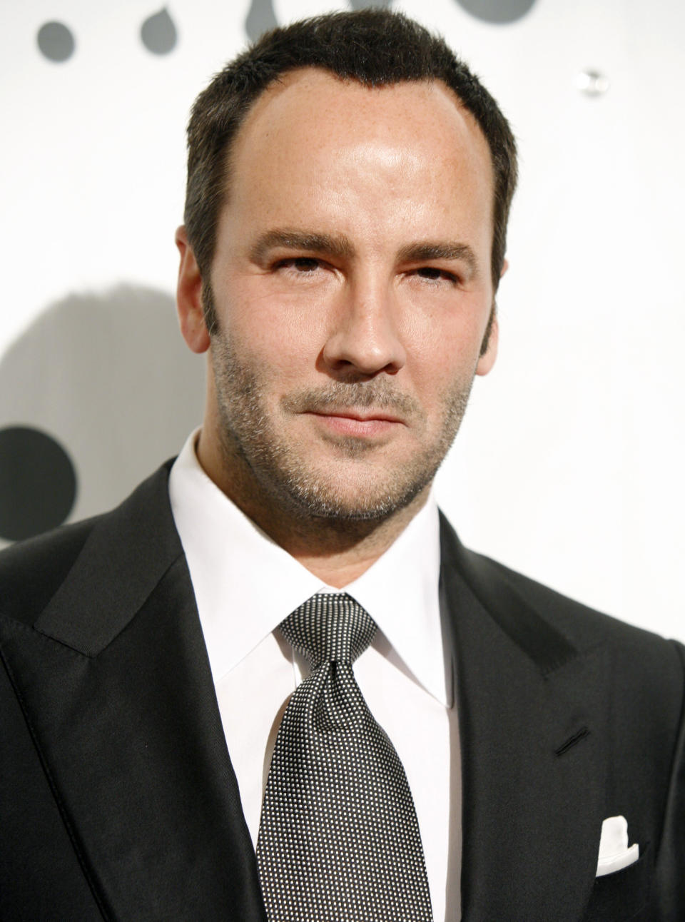 FILE - In this March 26, 2007 file photo designer Tom Ford arrives at the 18th annual GLAAD media awards in New York. A debut design showcase by singer Rihanna and Tom Ford's first proper catwalk show in London Fashion Week are headlining the five-day style extravaganza that begins Friday Feb. 15, 2013. (AP Photo/Diane Bondareff, file)