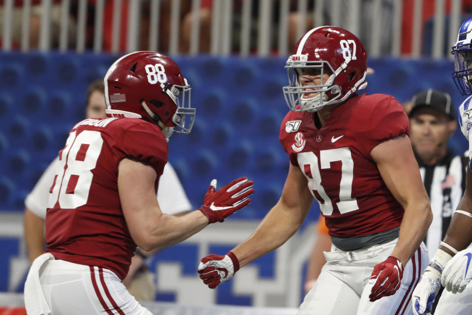 Alabama tight end Miller Forristall (87) celebrates with Major Tennison (88) after catching a touchdown pass in the first half of an NCAA college football game against Duke, Saturday, Aug. 31, 2019, in Atlanta. (AP Photo/John Bazemore)