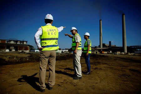 Chinese employees of Shanghai Electric company supervise the construction site of a biomass power station in Ciro Redondo, Cuba, February 9, 2017. REUTERS/Alexandre Meneghini