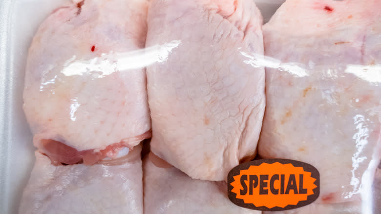 Packaged, labeled chicken in store