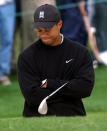 <p>Defending champion Tiger Woods contemplates his shot before hitting from the bunker on the 2nd hole during first round play of the 2003 Masters at the Augusta National Golf Club in Augusta, Ga., Friday, April 11, 2003. (AP Photo/Elise Amendola) </p>
