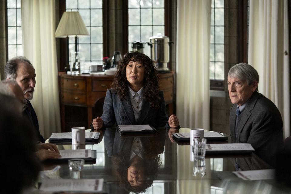 This image released by Netflix shows Ken Bolden, from left, Sandra Oh and Mark Philip Stevenson in a scene from "The Chair." (Eliza Morse/Netflix via AP)