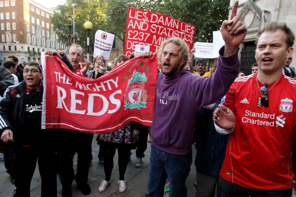 Liverpool fans demonstrate outside the High Court in 2010 as RBS seek high court order to prevent the American co-owners, Tom Hicks and George Gillett Jr, from removing the chairman Martin Broughton and another board member Photo: Oli Scarff/Getty Images