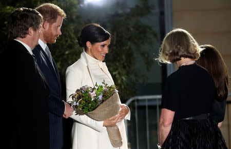 Britain's Meghan, Duchess of Sussex, is greeted with flowers at the Natural History Museum with Prince Harry in London, Britain February 12, 2019. REUTERS/Hannah McKay