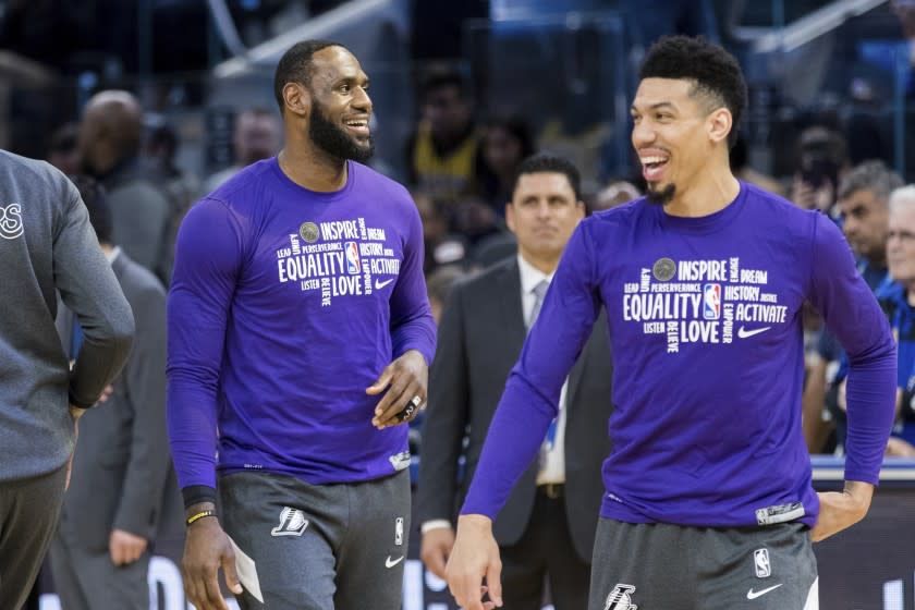 Los Angeles Lakers forward LeBron James, left, warms up with forward Danny Green before an NBA basketball game against the Golden State Warriors in San Francisco Saturday, Feb. 8, 2020. The Lakers won 125-120. (AP Photo/John Hefti)