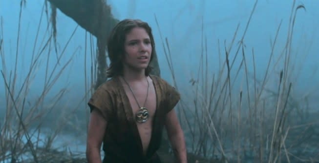 Atreyu looks upset standing in a swamp