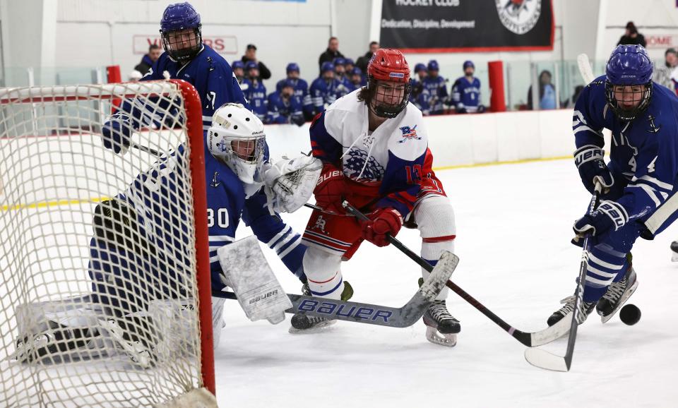 Bridgewater-Raynham's Bobby Quill looks for a rebound from Scituate goalie Thomas McMellen and Johnny Donahue during a game on Saturday, Feb. 4, 2023.