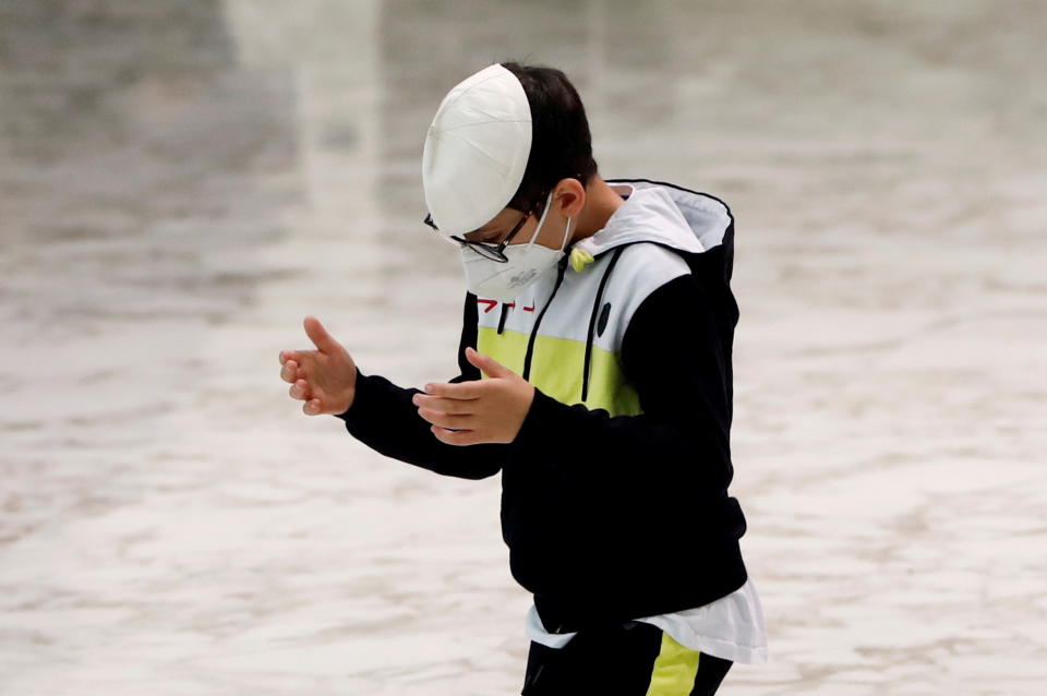 A boy wears a skullcap that was gifted to him after joining Pope Francis on stage during the weekly general audience at the Vatican, October 20, 2021. REUTERS/Remo Casilli