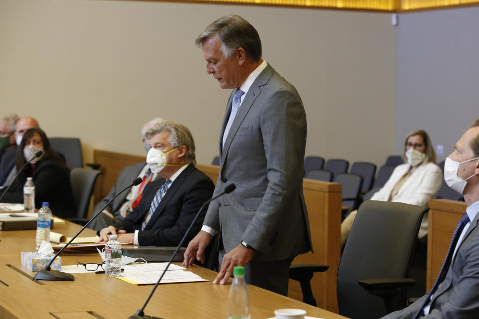 Bill Smith, interim chief executive officer and president of PG&E Corp., reads a closing statement during the criminal sentencing hearing in the trial of Pacific Gas & Electric Corp in Chico, Calif., Thursday, June 18, 2020. Pacific Gas & Electric on Thursday was fined $4 million for the deaths of 84 people killed in a nightmarish Northern California wildfire ignited by the its long-neglected electrical grid. The sentencing comes as the nation's largest utility prepares to end a 17-month bankruptcy proceeding triggered by the catastrophe. (AP Photo/Rich Pedroncelli, Pool)