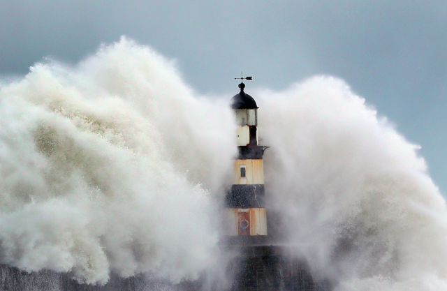 Giant waves crashing over Seaham lighthouse near Durham during last year’s “Beast from the East” (Picture: PA)