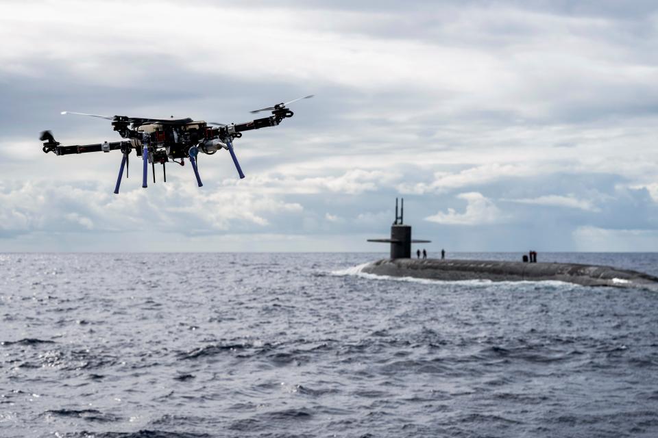 An unmanned aerial vehicle delivers a payload to the ballistic missile submarine USS Henry M. Jackson around the Hawaiian Islands, Oct. 19, 2020, during an event designed to test and evaluate the tactics, techniques and procedures of U.S. Strategic Command's expeditionary logistics and enhance the readiness of strategic forces.