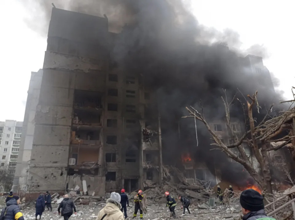 Firefighters work to extinguish a fire at a damaged city center after a Russian air raid in Chernigiv, Ukraine, Thursday, March 3, 2022. Russian forces have escalated their attacks on crowded cities in what Ukraine's leader called a blatant campaign of terror. (AP Photo/Dmytro Kumaka)