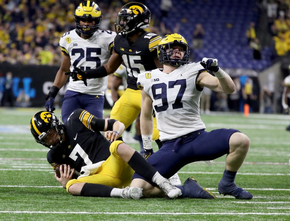 Michigan defensive end Aidan Hutchinson sacks Iowa quarterback Spencer Petras during the first half of the Big Ten championship game at Lucas Oil Stadium in Indianapolis on Saturday, Dec. 4, 2021.