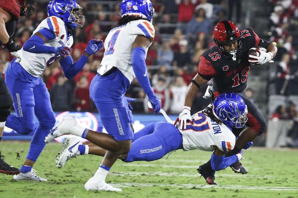 Boise State safety Zion Washington tackles San Diego State running back Martin Blake (13) during an NCAA college football game Friday, Sept. 22, 2023, in San Diego. (Meg McLaughlin/The San Diego Union-Tribune via AP)