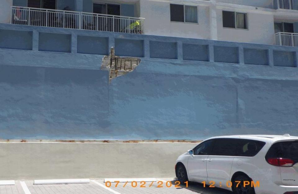 A Miami Beach building inspector photographed this spalling in the concrete on the south side of the Port Royale Condo before issuing the building an unsafe structures violation on July 6. The concrete has broken off, revealing rebar.