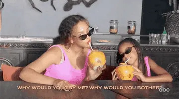 Beyoncé and Blue Ivy drinking from tropical bowls through straws