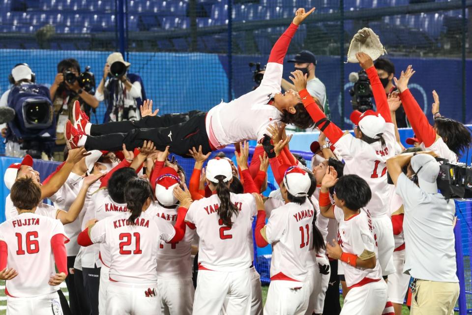 Players crowd surf a man.