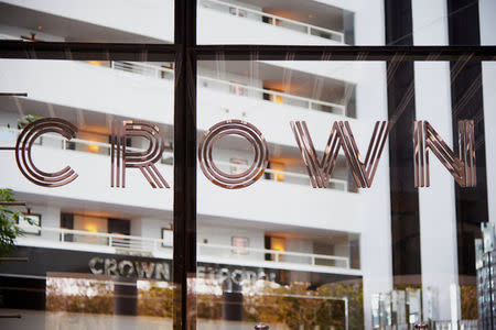 The name of Australia's top casino operator Crown Resorts adorns a window at an entrance to the Crown Perth hotel and casino complex in Western Australia, October 20, 2016. REUTERS/Aaron Bunch