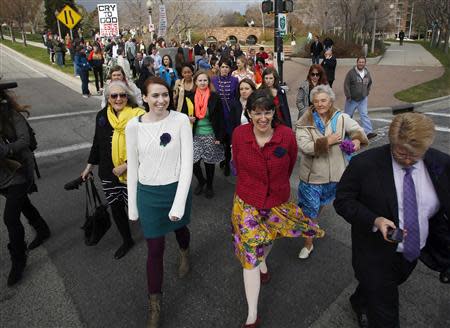 A group of Mormon women walk to Temple Square in an attempt to get tickets to the priesthood meeting at the The Church of Jesus Christ of Latter-day Saints semi-annual gathering known as general conference in Salt Lake City, Utah April 5, 2014. REUTERS/Jim Urquhart