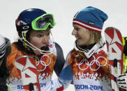 United States' Mikaela Shiffrin, left, and Austria's Marlies Schild celebrate winning gold and silver in the women's slalom at the Sochi 2014 Winter Olympics, Friday, Feb. 21, 2014, in Krasnaya Polyana, Russia. (AP Photo/Gero Breloer)