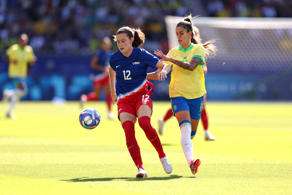 PARIS, FRANCE - AUGUST 10: Tierna Davidson #12 of Team United States and Jheniffer #11 of Team Brazil battle for the ball during the Women's Gold Medal match between Brazil and United States of America during the Olympic Games Paris 2024 at Parc des Princes on August 10, 2024 in Paris, France. (Photo by Robert Cianflone/Getty Images)