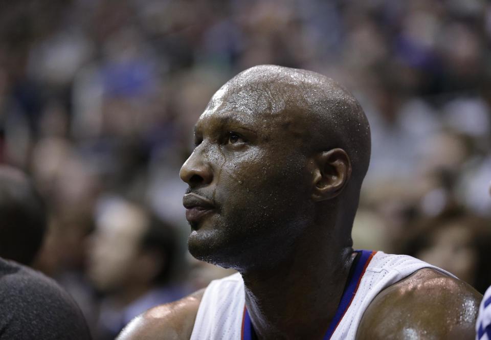 FILE - In this Dec. 28, 2012 file photo, Los Angeles Clippers power forward Lamar Odom sits on the bench during the second half of an NBA game against the utah Jazz, in Salt Lake City. Odom is breaking his silence with his first post on Twitter since the NBA star was arrested and charged with driving under the influence last month. Odom tweeted "Seeing the snakes" on Tuesday night, Sept. 24, 2013, in his first post since his Aug. 30 arrest. (AP Photo/Rick Bowmer, File)