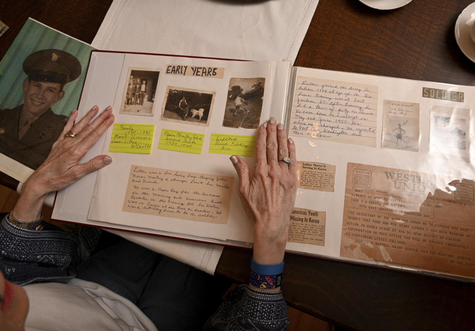 Judy Wade, niece of Luther Story, shows memory scrapbook of Luther Story, that her mother put together, Thursday, May 18, 2023, in Americus, Georgia. Army Pfc. Luther Herschel Story was awarded the Medal of Honor after he went missing in battle during the Korean War is being buried on Memorial Day near his hometown in Georgia. Wounded Story was last seen on Sept. 1, 1950, when he stayed behind to cover his infantry unit's retreat. (Hyosub Shin/Atlanta Journal-Constitution via AP)