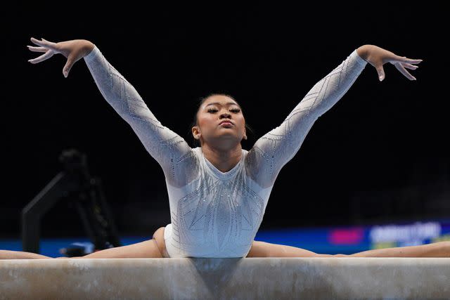 <p>LOREN ELLIOTT/AFP via Getty </p> Suni Lee competes at the 2023 US Gymnastics Championships on Aug. 27.