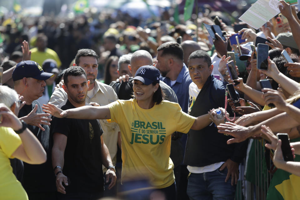 Former First Lady Michelle Bolsonaro greets supporters during a demonstration calling for freedom of expression, spurred by Brazilian court orders to suspend accounts on the social media platform X, in Copacabana beach, Rio de Janeiro, Brazil, Sunday, April 21, 2024. (AP Photo/Bruna Prado)