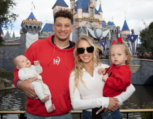 ANAHEIM, CALIFORNIA – FEBRUARY 13: In this handout image provided by Disney, Patrick Mahomes of the Kansas City Chiefs and Brittney Mahomes pose with their children, Sterling, 1, and Bronze, 11 weeks old, in front of Sleeping Beauty Castle at Disneyland Park on February 13, 2023, in Anaheim, California. Mahomes visited the Disneyland Resort during the Disney100 Celebration less than 24 hours after the Kansas City Chiefs victory over the Philadelphia Eagles in Super Bowl LVII. (Photo by Christian Thompson/Disneyland Resort via Getty Images)