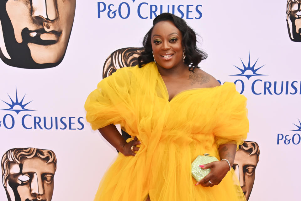 Judi Love, wearing a bright yellow off-shoulder gown, arrives at the 2023 BAFTA Television Awards with P&O Cruises at The Royal Festival Hall on May 14, 2023 in London, England. (Photo by Dave Benett/Getty Images)