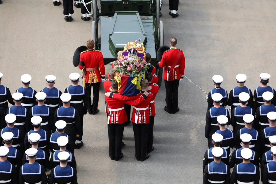 Pictured: The Bearer Party, formed of personnel from The Queen?s Company, 1st Battalion The Grenadier Guards, transfer the coffin of Her Majesty Queen Elizabeth II from The State Gun Carriage.    The UK Armed Forces have played a part in the procession for Her Majesty The Queen?s funeral and committal service today, in London and Windsor.    Marking the end to 10 days of proceedings, service personnel representing a variety of regiments, ships and air stations that held a special relationship with Her Majesty The Queen took part in the funeral processions in London and Windsor.    Around 4,000 regular and reserve soldiers, sailors, marines and aviators, as well as musicians from Armed Forces bands, took part in the proceedings today. This included over 3,000 military personnel in central London, with 1,650 personnel forming part of the procession from the Palace of Westminster to Westminster Abbey and procession from Westminster Abbey to Wellington Arch.    In Windsor, over 1,000 military personnel were involved in ceremonial activity, including 410 taking part in the procession from Albert Road, Windsor, to St George?s Chapel, Windsor Castle.    Cpl Tim Hammond/Pool via REUTERS
