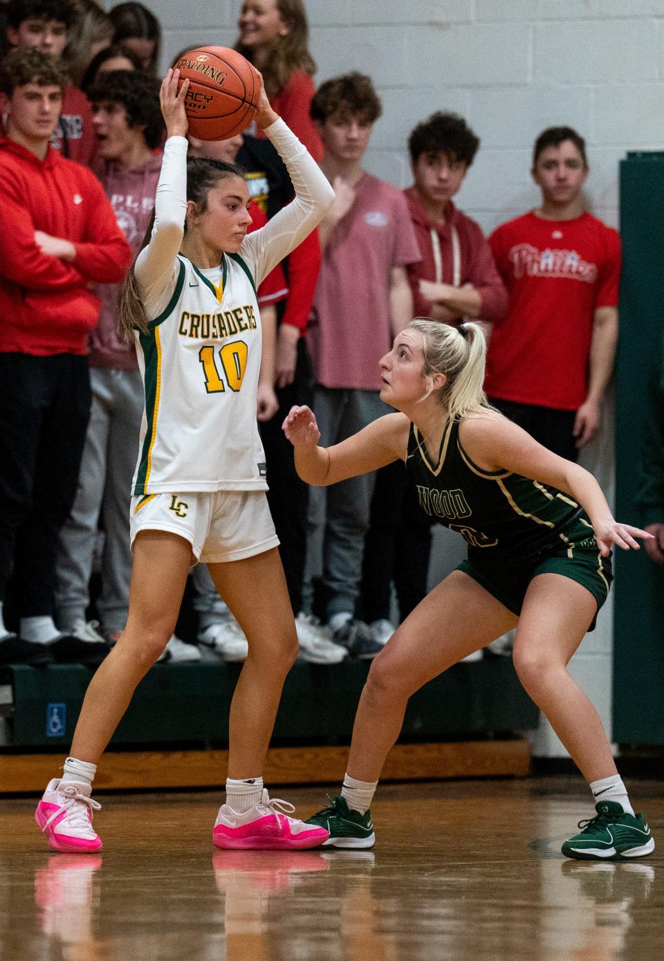 Lansdale Catholic's Nadia Yemola (10) against Archbishop Wood's Sophia Topakas (10) during their girls' basketball game in Lansdale on Tuesday, Jan. 23, 2024.

Daniella Heminghaus | Bucks County Courier Times