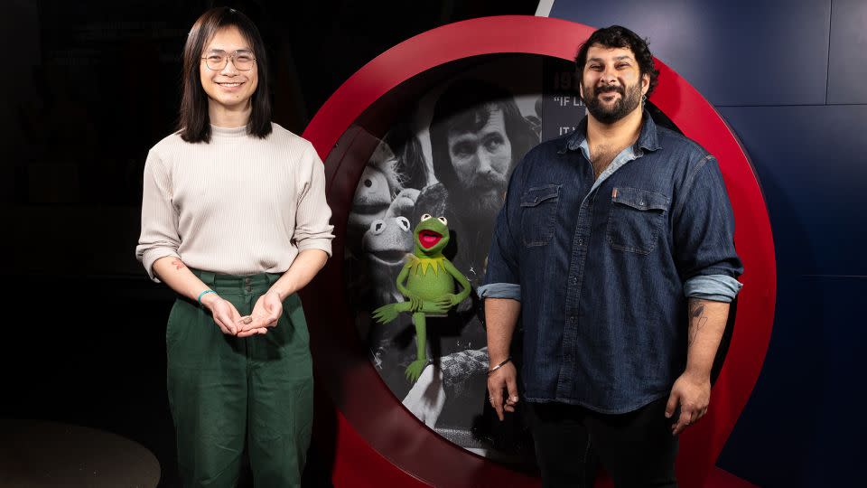 Authors of the new paper, Calvin So (left) and Arjan Mann (right), named the prehistoric amphibian after Kermit the Frog.  The Muppet icon was photographed in the Entertainment Nation exhibit at the Smithsonian's National Museum of American History.  -James D. Tiller/James D. Loreto/Courtesy National Museum of Natural History Smithsonian