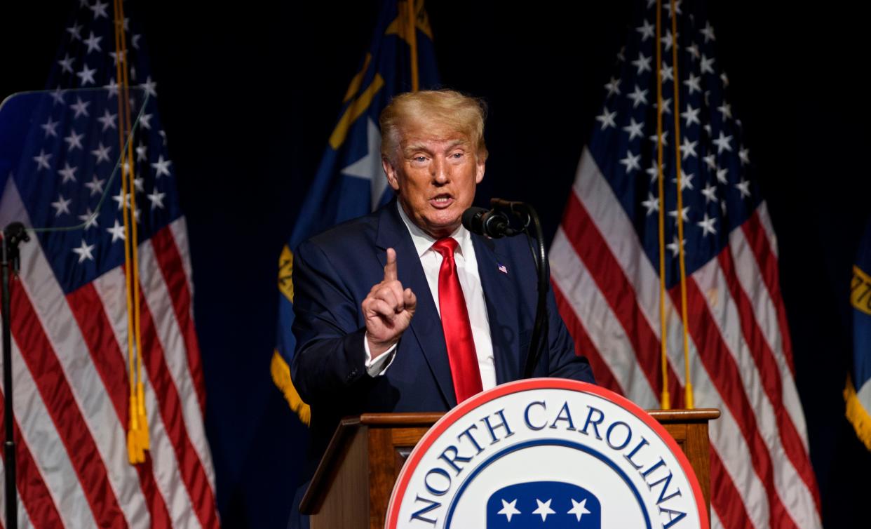 Former US President Donald Trump addresses the NCGOP state convention on June 5, 2021 in Greenville, North Carolina. Mr Trump has sought to claim credit for Vice President Kamala Harris’s plans to visit the US-Mexico border. (Getty Images)