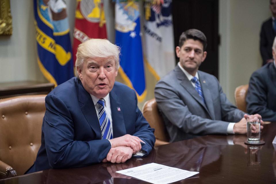 House Speaker Paul Ryan, right, released a statement condemning white supremacists, but not calling out statements on the matter from&nbsp;President Donald Trump. (Photo: Nicholas Kamm/AFP/Getty Images)