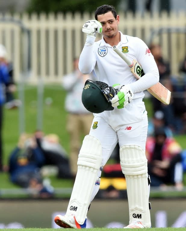 South Africa's batsman Quinton de Kock celebrates his 100-runs on the third day's play of their second Test match against Australia, in Hobart, on November 14, 2016