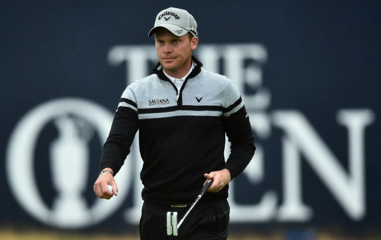 England's Danny Willett reacts on the 18th green during his second round on day two of the 2016 British Open Golf Championship at Royal Troon in Scotland on July 15, 2016